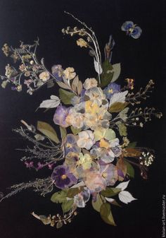 an arrangement of flowers on a black background