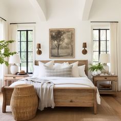 a bedroom with white walls and wooden furniture