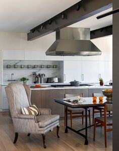 the kitchen is clean and ready to be used as a dining room or living room