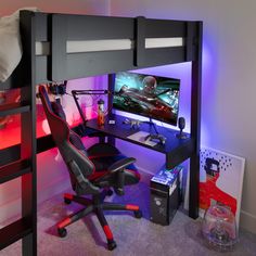 a loft bed with a desk underneath it and a gaming chair under the bunk bed