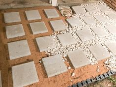 cement blocks laid out on the ground for construction