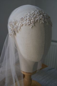 a mannequin with a veil on top of it