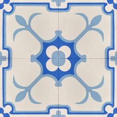 a blue and white tile design on the floor