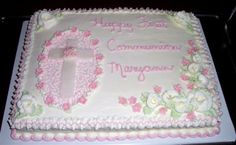 a cake that is decorated with flowers and a cross