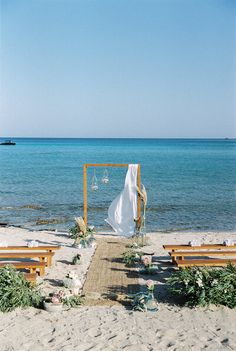 an outdoor wedding setup on the beach