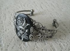 This beautiful silver plated filigree cuff bracelet has a rose cameo setting with silver plated filigree accents on the sides. Adjustable. Victorian Bracelet, Gothic Bracelet, Jewelry Victorian, New Plymouth, Art Deco Bracelet, Hippie Bracelets, Pagan Jewelry, Neo Victorian, Edwardian Art