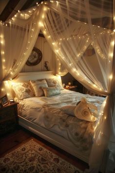 a bed with white curtains and lights on it