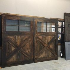 two wooden doors sitting next to each other in front of a tv on top of a table