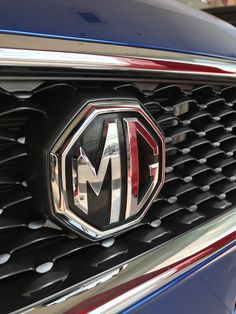 the front grille and badge of a masera brand car is seen in this image