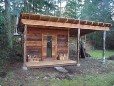 a small wooden cabin in the woods