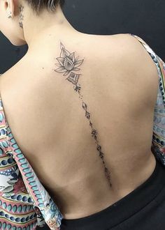 a woman with a tattoo on her back