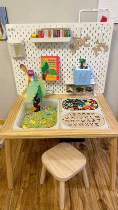 a child's play table with toys on it