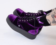 Walk right into a purple haze with these lush velvet boots. These cool creeper combat boots feature a vegan friendly purple velvet upper with a 7-eyelet lace up detail and a platform sole height that is about 1 ¾” at the heel and 1 ¼” in the front. Has removable memory foam insoles for added comfort and inside zipper closure for easy on/off. Shoes Purple Aesthetic, Purple Velvet Shoes, Dark Purple Shoes, Platforms Boots, Y2k Boots, Creeper Boots, Purple Goth, Goth Stuff, Teal Shoes