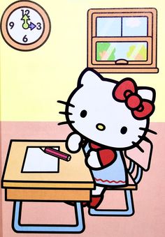 the hello kitty is writing at her desk