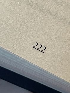 the number 22 is placed on top of an open book with no pages in it