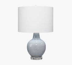 a gray table lamp with a white shade