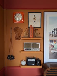 there is a clock, pictures and other items on the wall