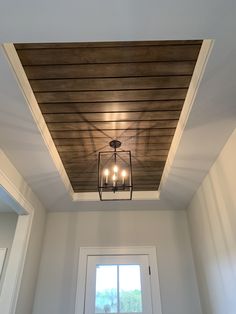 a light fixture hanging from the ceiling in a room