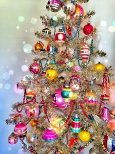 a colorful christmas tree with ornaments on it