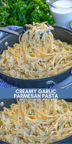 creamy garlic parmesan pasta in a skillet on a blue and white towel