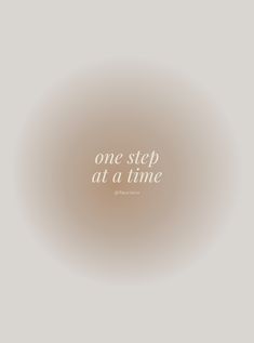 the words one step at a time are written in white on a light gray background