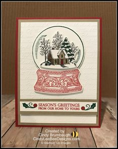 a christmas card with a snow globe on it and the words season's greetings from our home to yours