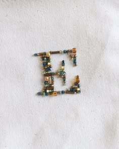 the beaded letters e are made from beads