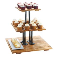 three tiered wooden tray with cupcakes on it