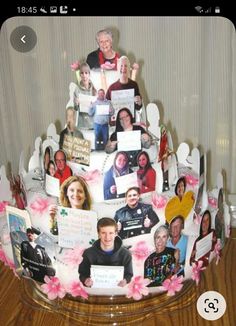 a cake decorated with photos and flowers on it