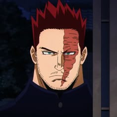 a man with red hair and blue eyes stares at the camera while standing in front of a window