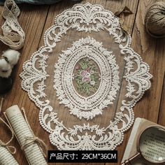 the table is covered with lace and yarn