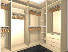 a white closet with lots of drawers and hanging wooden hangers on the wall next to it