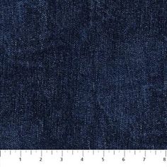 a ruler is shown next to a blue jean denim fabric texture that has been stitched together