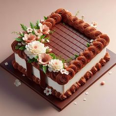 a chocolate cake decorated with flowers and leaves