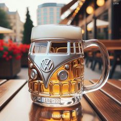 a beer mug sitting on top of a wooden table