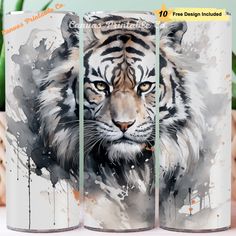 two coffee mugs with an image of a tiger on them