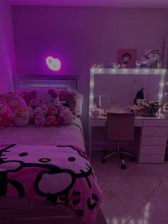 a bedroom with hello kitty bedding and purple lighting