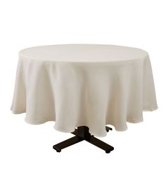 a round table with a white cloth on it