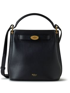 The Mulberry Islington Leather Bucket Bag is crafted from grained calf leather. It features a logo stamp on the front, logo-engraved gold-tone hardware, a twist-lock fastening, an adjustable and detachable shoulder strap, a single top handle, an internal logo stamp, an internal patch pocket, and a main compartment. The bag is small in size and has a textured finish. Black Top Handle Bag, Soft Preppy, Cool Purses, Mulberry Handbags, Taking A Walk, Dream Bag, Oversized Sweaters, Classic Handbags, Handbag Heaven