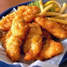 fried fish and french fries on a blue plate