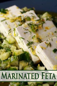 some food that is on top of a plate with the words marinated feta