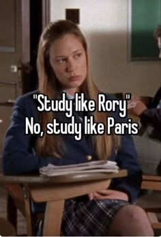 a woman sitting at a desk with the words study like roxy no, study like paris