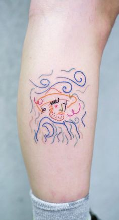 a person with a tattoo on their leg