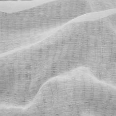 an abstract white background with wavy lines and folds in the fabric, as if it were linen