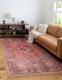 a living room filled with furniture and a rug