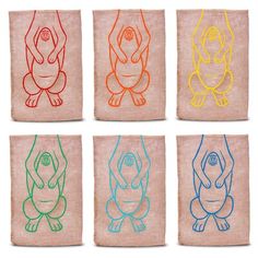 four different colored images of animals on towels