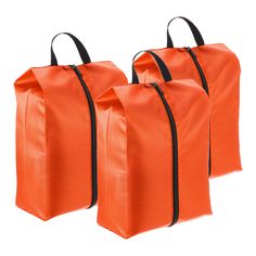 three orange bags with black handles on each side