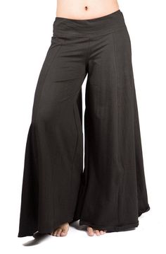 "Palazzo style pant, fitted at waist via elastic, flows out in an A-shape. Stretchy and comfortable. Long inseam and long legged. Looks like a skirt! Free flowing and wonderful to dance in. Pair with one of our crop tops for a classic Mishu style outfit! Approximate measurements: XS: Inseam: 29\" Hip: 34-40\" Waist:28-32\" Length 39\" S: Inseam: 30\" Hip: 36-42\" Waist:30-36\" Length 39\" M: Inseam: 31\" Hip: 38-46\" Waist: 32-40\" Length 39\" L: Inseam: 31\" Hip: 42-48\" Waist: 34-42\" Length 4 Solid Color Full Length Cotton Bottoms, Solid Color Full-length Cotton Bottoms, Chic Full-length Relaxed Fit Harem Pants, Cotton Stretch Wide-leg Bottoms, Versatile Full Length Cotton Wide Leg Pants, Versatile Full-length Cotton Wide Leg Pants, Versatile Cotton Wide Leg Full-length Pants, Black Wide-leg Yoga Bottoms, Wide Leg Cotton Pants With Loosely Fitted Hips