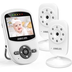 an electronic baby monitor with two cameras next to it