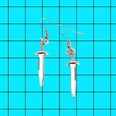 -Hypoallergenic stainless steel hooks. Comes with a rubber backing -Measurements: 1.7" x 0.4" Knife Earrings, Goth Egirl, Star Knife, Goth Rock, Goth Earrings, Trendy Streetwear, Face Earrings, Grunge Goth, Themed Jewelry